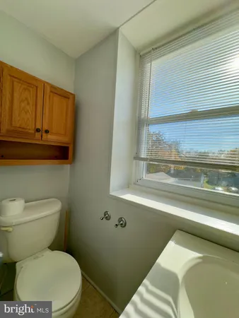 an empty room with a empty space and windows