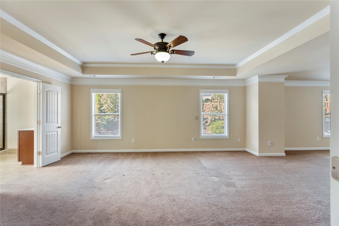 1005 Winmar Drive Anderson, SC 29621 - Photo 30 of 50 This expansive primary bedroom offers ample space and features a ceiling fan, crown molding, and tray ceilings.