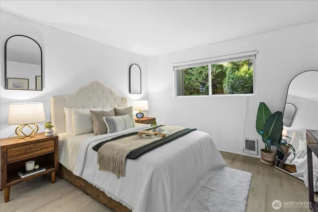 a bedroom with bed and window