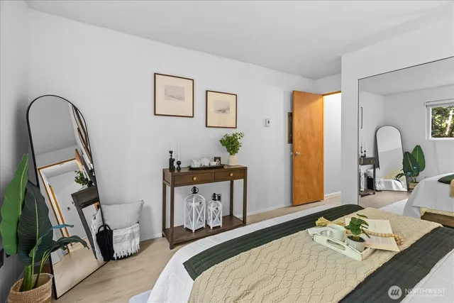 a view of a room with wooden floor and cabinet