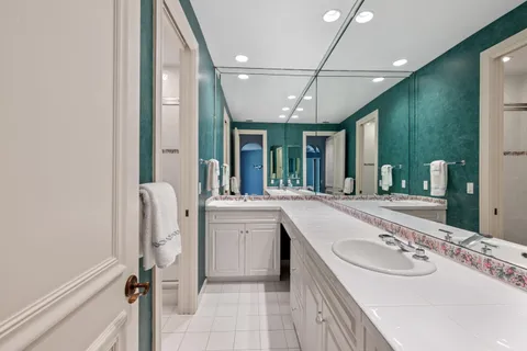 a view of a patio with table and chairs and potted plants