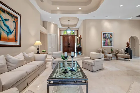 a living room with furniture and a painting