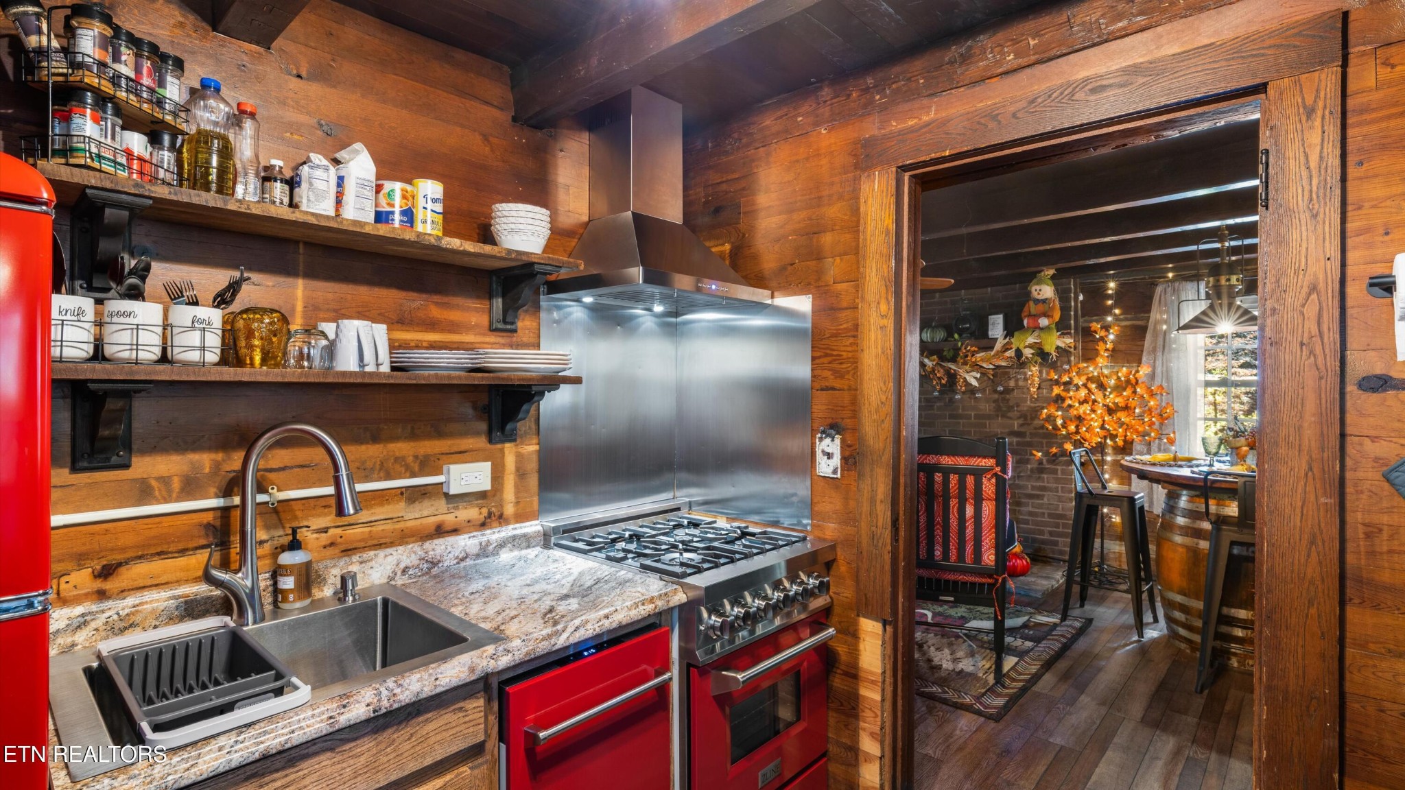 1131 Old Cartertown Road Gatlinburg, TN 37738 - Photo 8 of 18 a kitchen with a stove and a table
