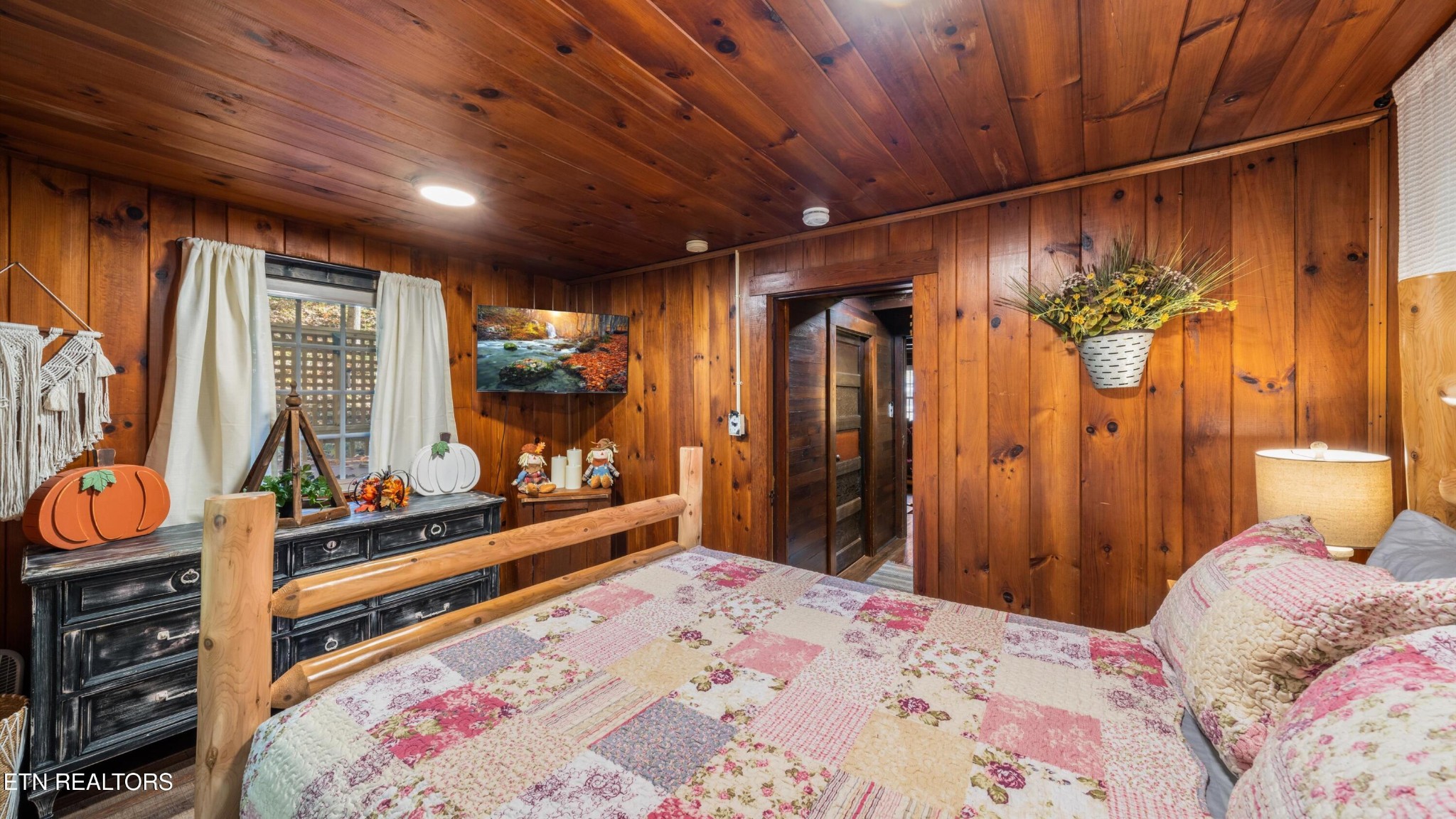 1131 Old Cartertown Road Gatlinburg, TN 37738 - Photo 9 of 18 a bedroom with a bed and large windows