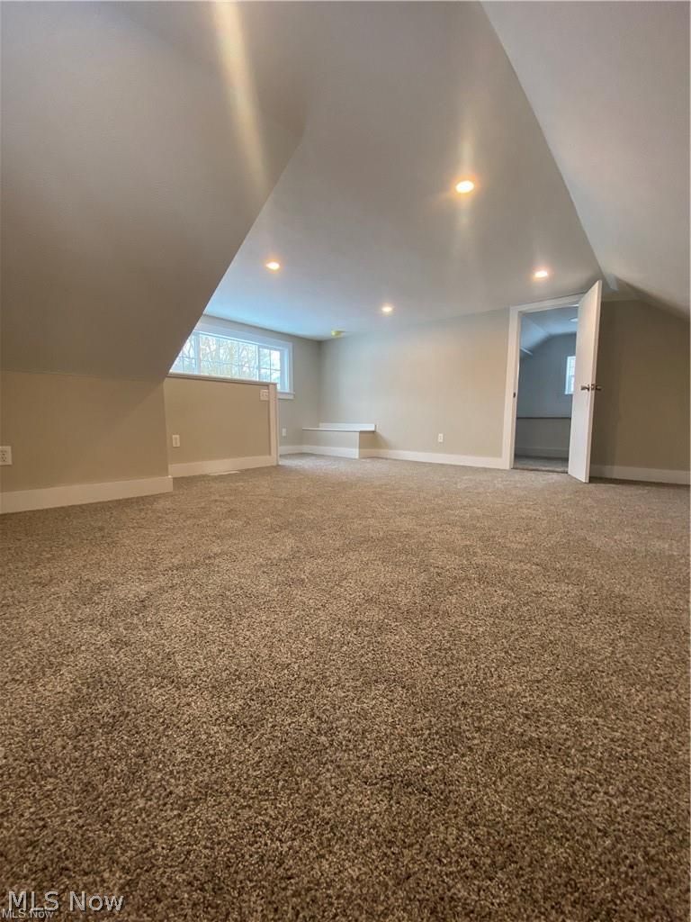 2803 State Road Vermilion, OH 44089 - Photo 18 of 28 Same bedroom with vaulted ceiling, brand new carpet, and recessed lighting