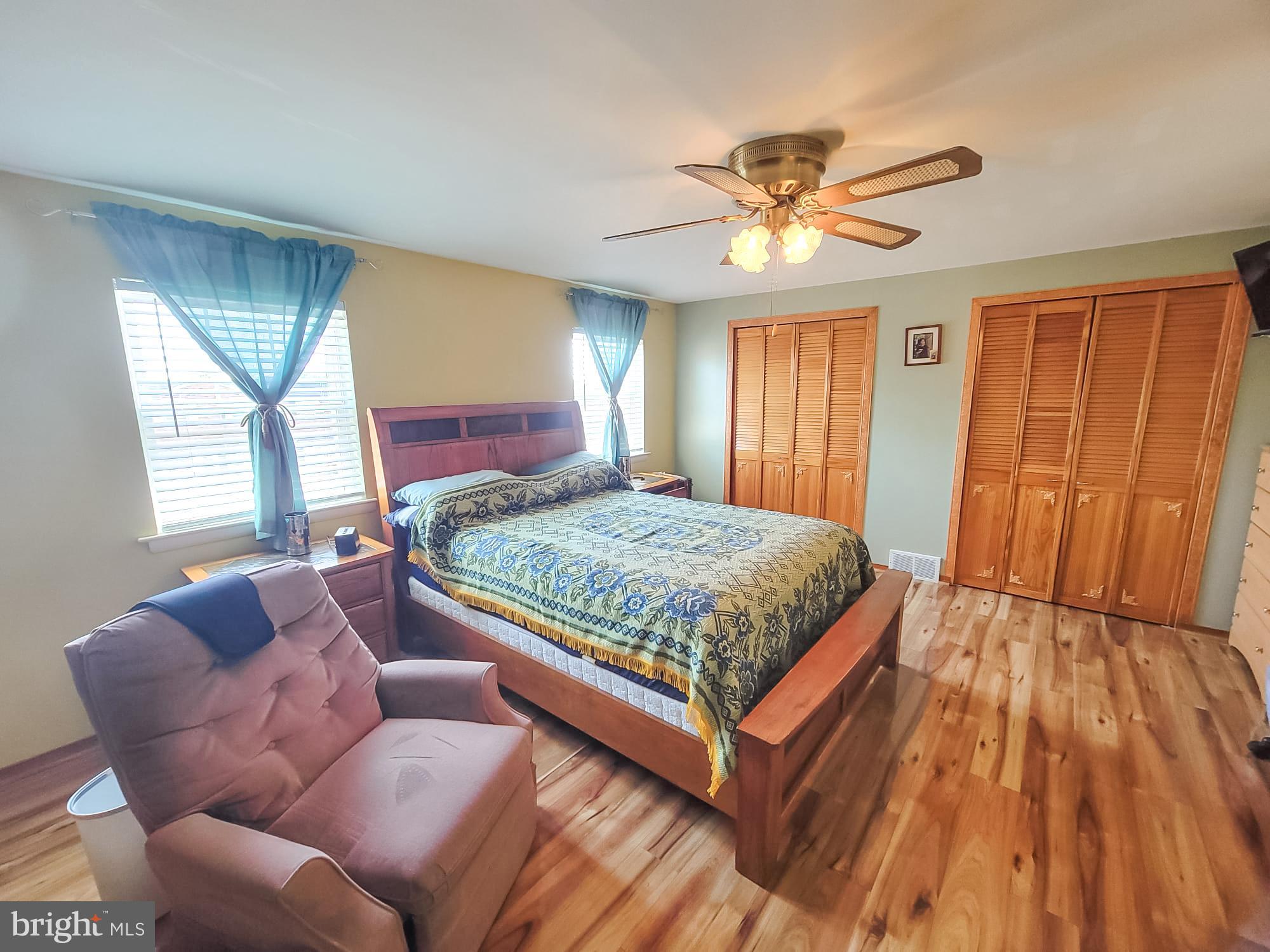 12628 Richton Road Philadelphia, PA 19154 - Photo 4 of 12 a bedroom with a large bed and a window