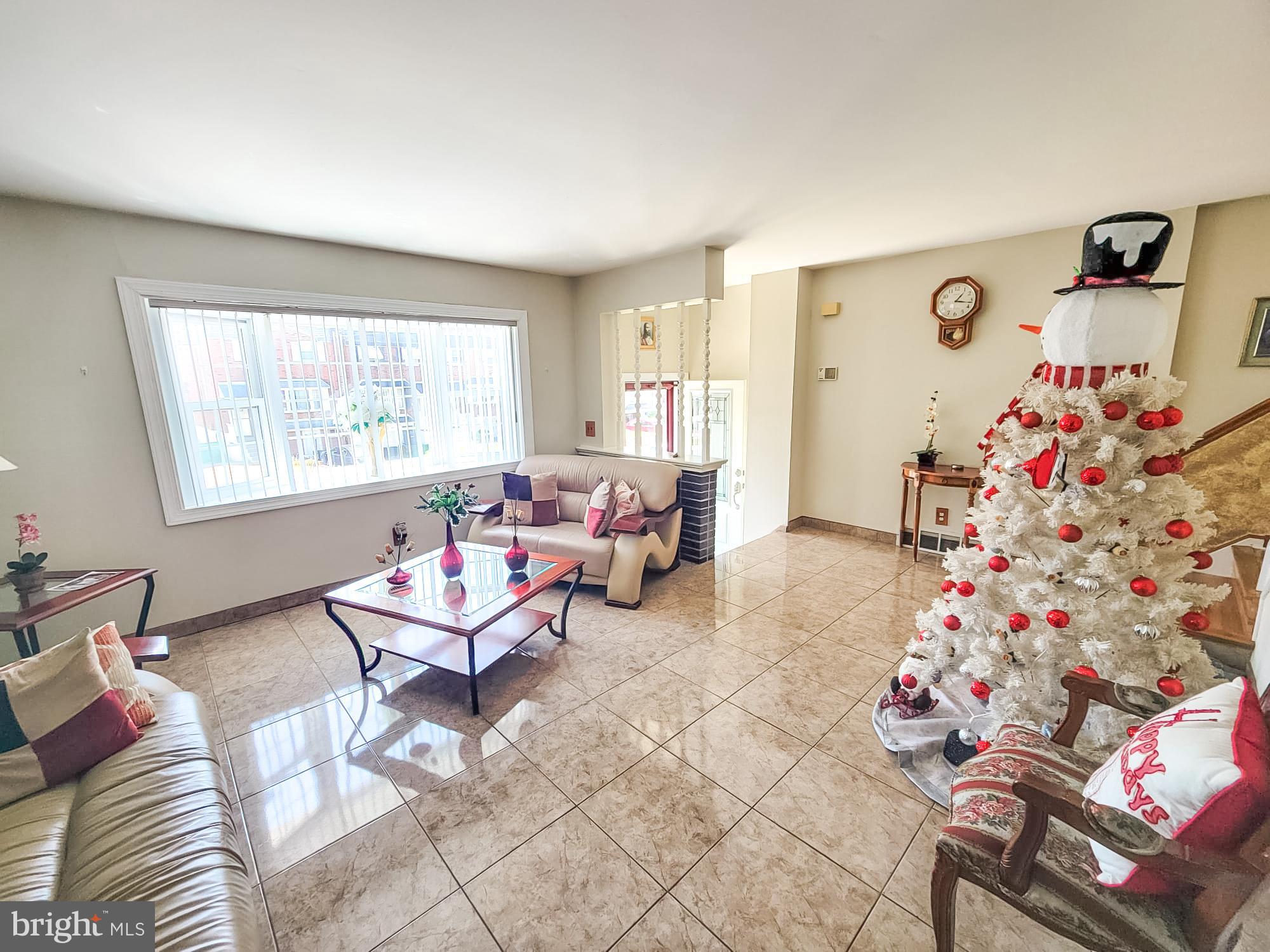12628 Richton Road Philadelphia, PA 19154 - Photo 5 of 12 a living room with furniture and a potted plant