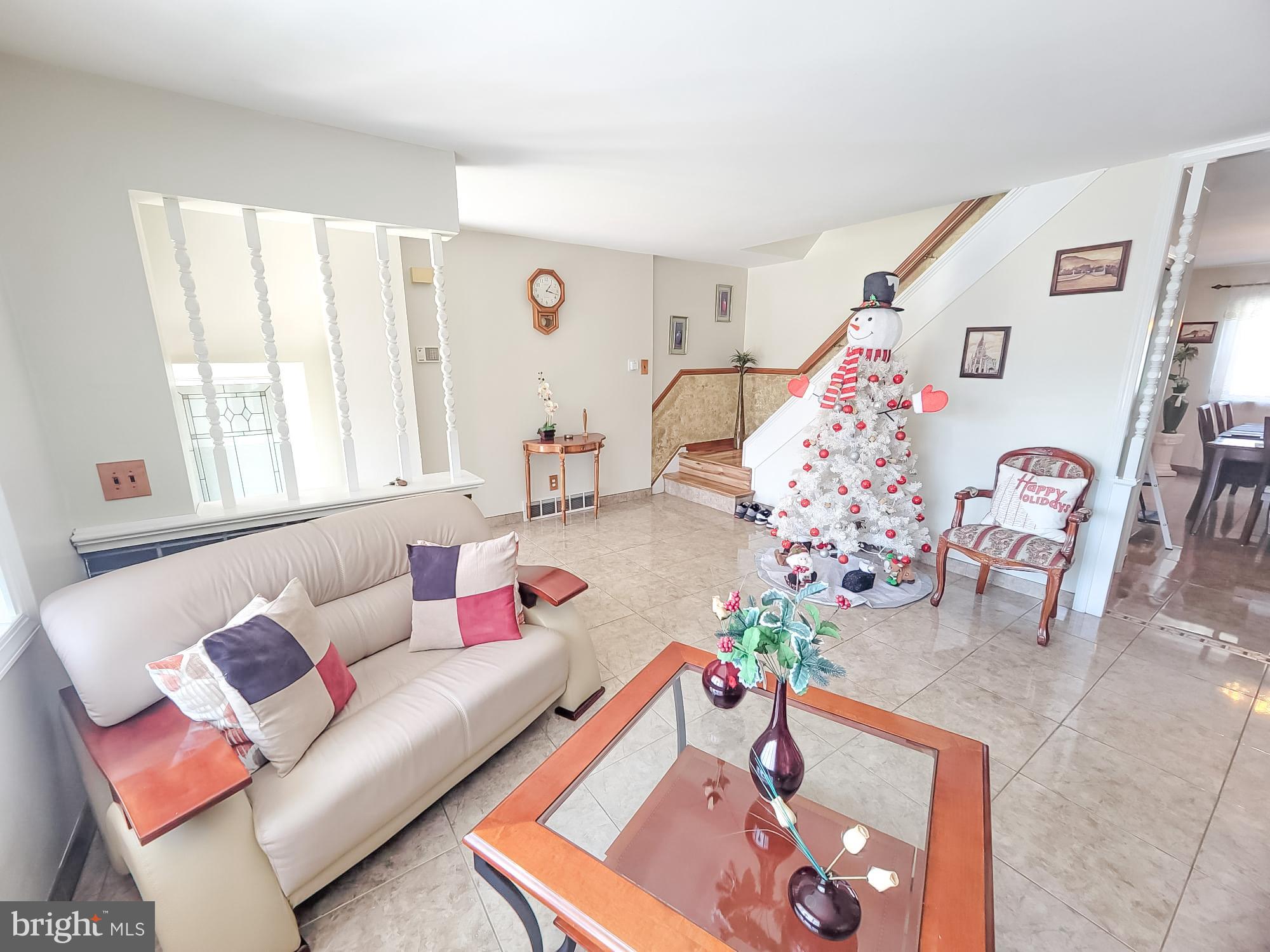 12628 Richton Road Philadelphia, PA 19154 - Photo 6 of 12 a living room with furniture and a couch
