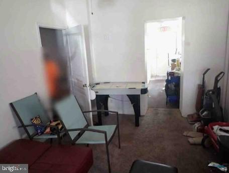 2821 West 3rd Street Chester, PA 19013 - Photo 4 of 9 a view of workspace and bedroom with furniture