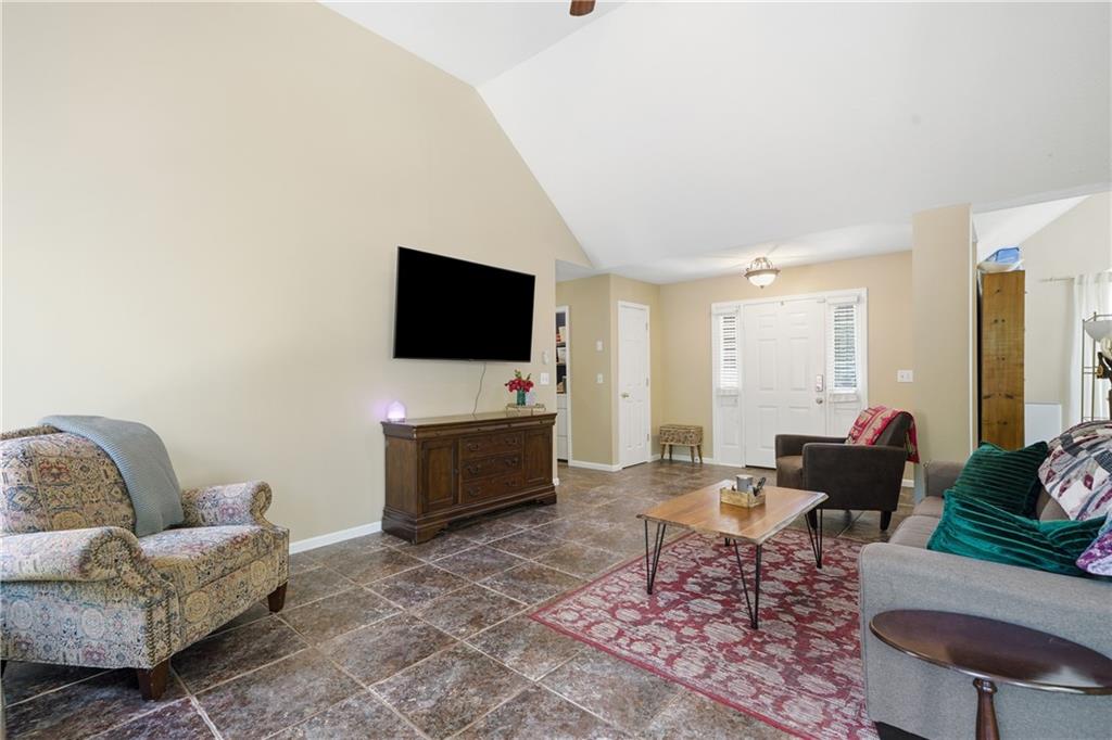 137 Orchard Way Southeast Calhoun, GA 30701 - Photo 26 of 39 a living room with furniture and a flat screen tv