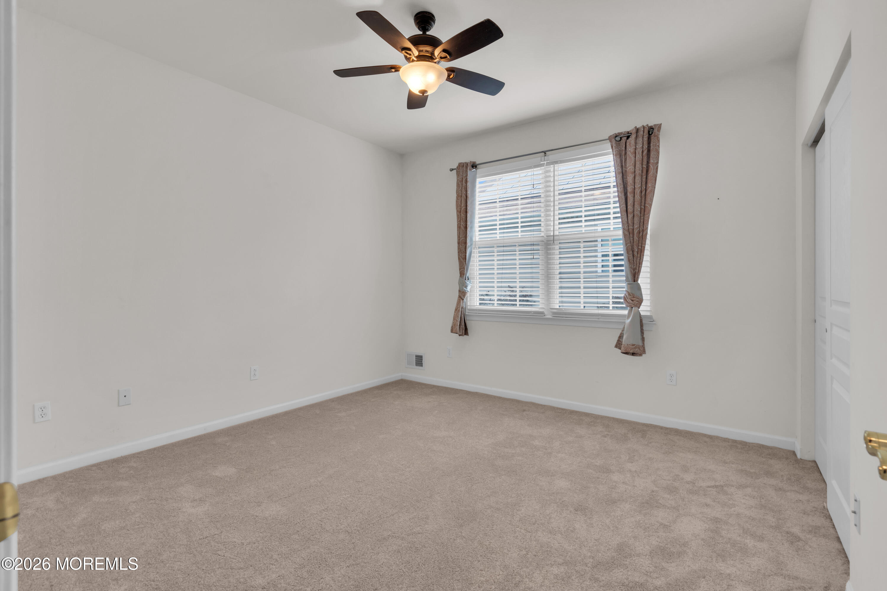 2 Daffodil Drive Little Egg Harbor, NJ 08087 - Photo 12 of 37 an empty room with windows and fan