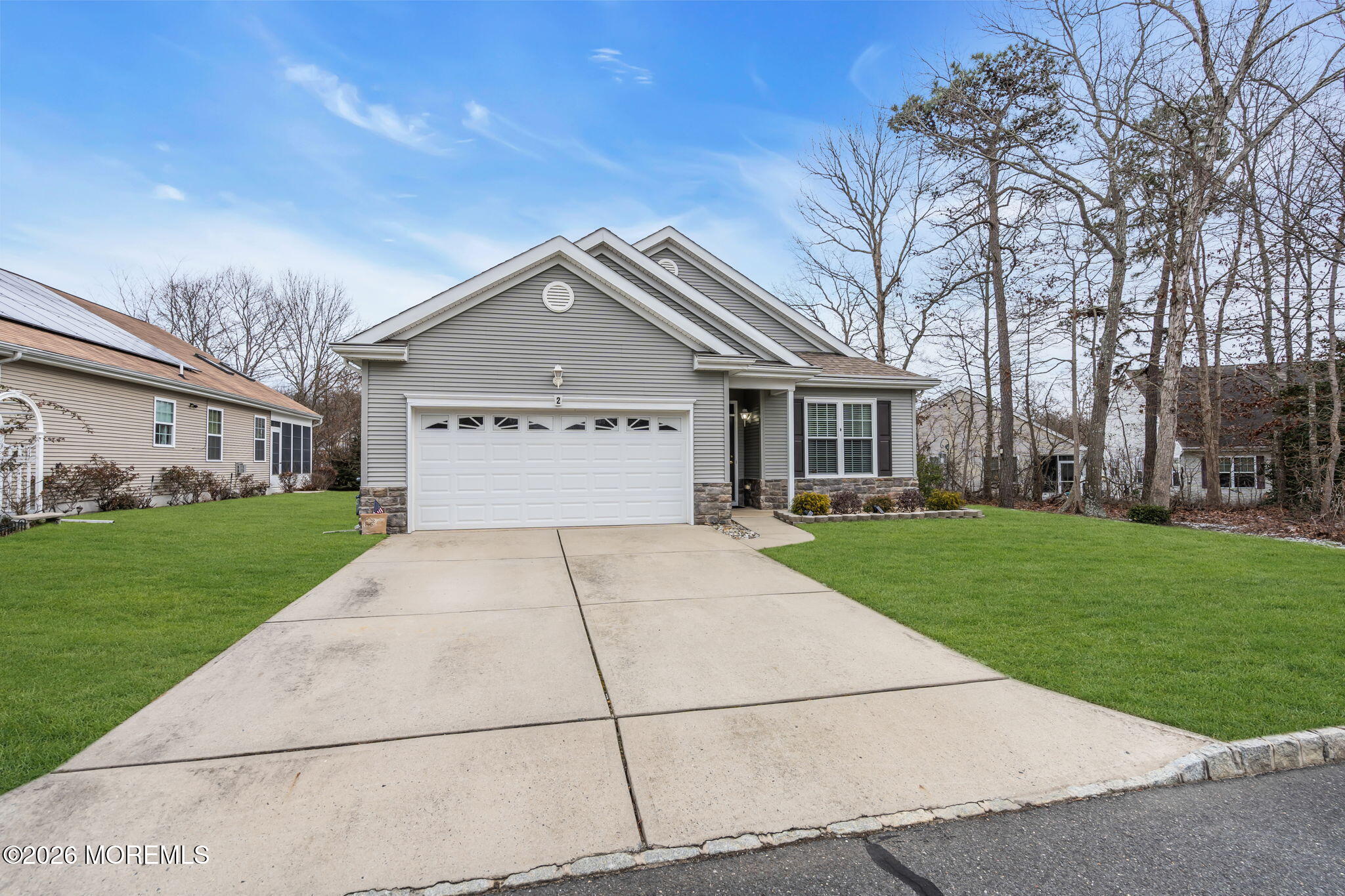 2 Daffodil Drive Little Egg Harbor, NJ 08087 - Photo 17 of 37 a front view of a house with a yard and garage