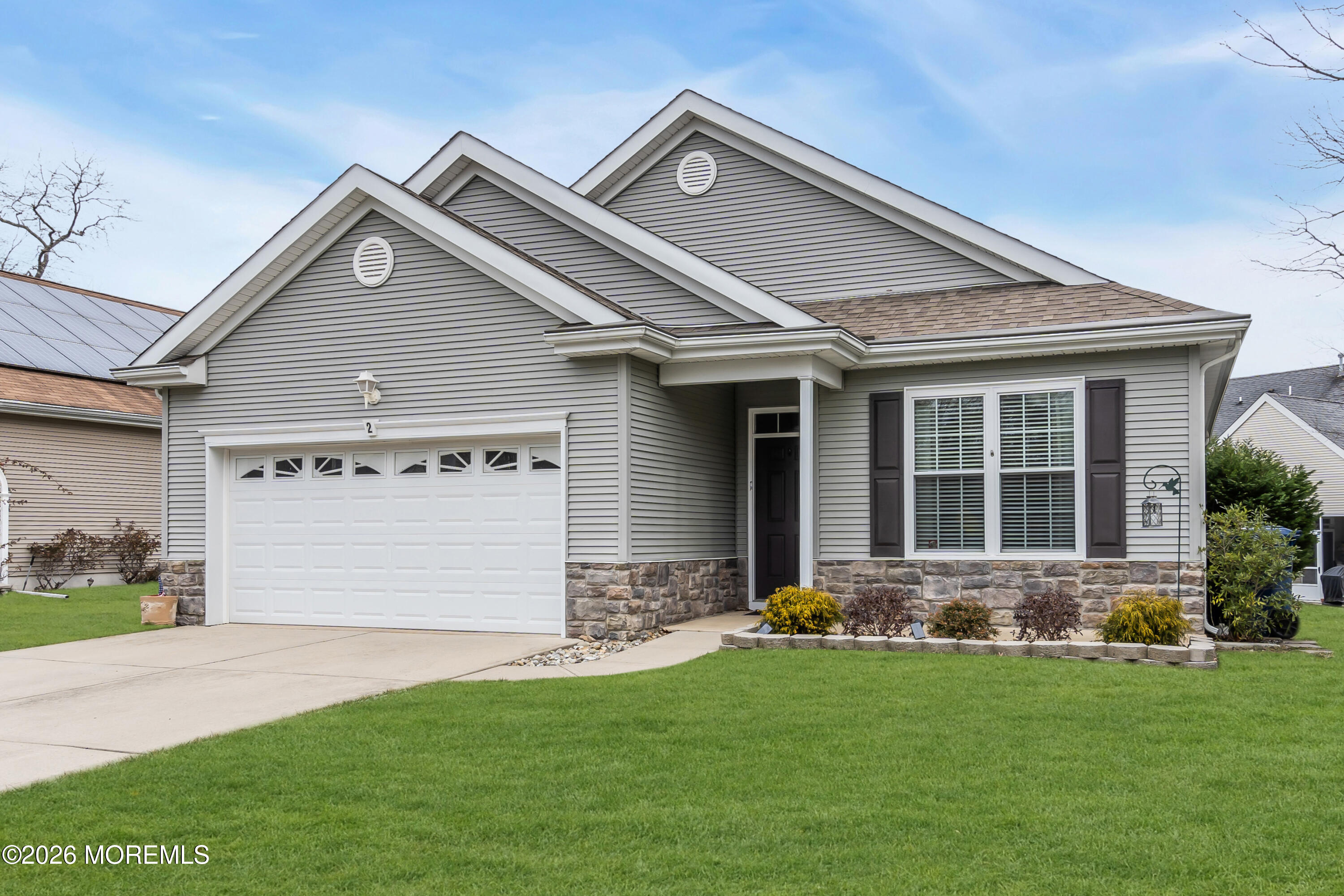 2 Daffodil Drive Little Egg Harbor, NJ 08087 - Photo 18 of 37 a front view of a house with a yard and garage
