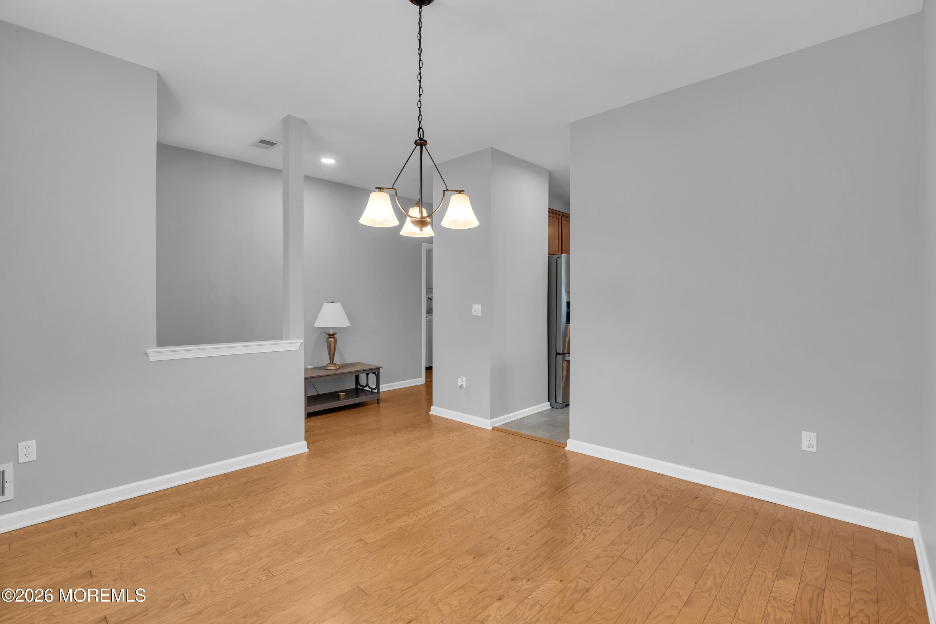 2 Daffodil Drive Little Egg Harbor, NJ 08087 - Photo 20 of 37 a view of a room with a hanging light and kitchen