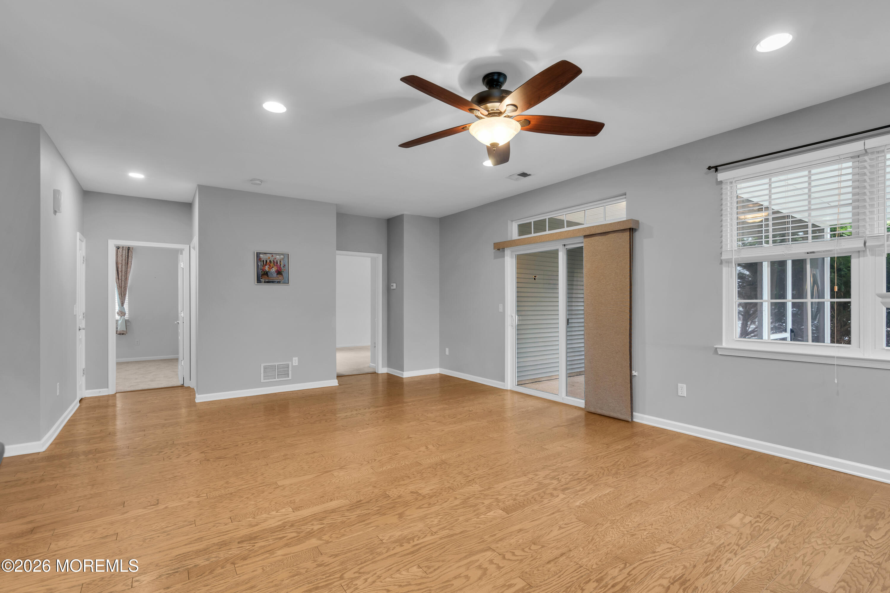 2 Daffodil Drive Little Egg Harbor, NJ 08087 - Photo 6 of 37 a view of an empty room with wooden floor and windows
