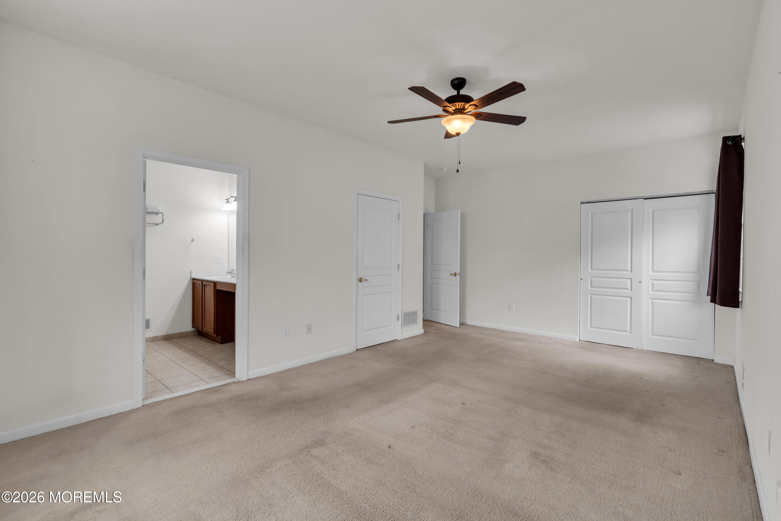 2 Daffodil Drive Little Egg Harbor, NJ 08087 - Photo 10 of 37 a view of a livingroom with a ceiling fan and window