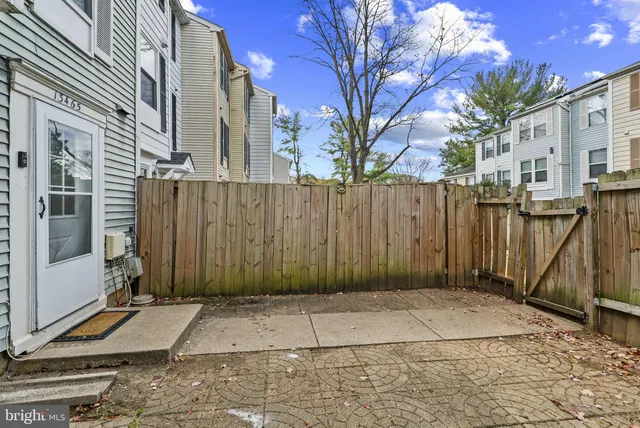 a view of a door with a wooden fence