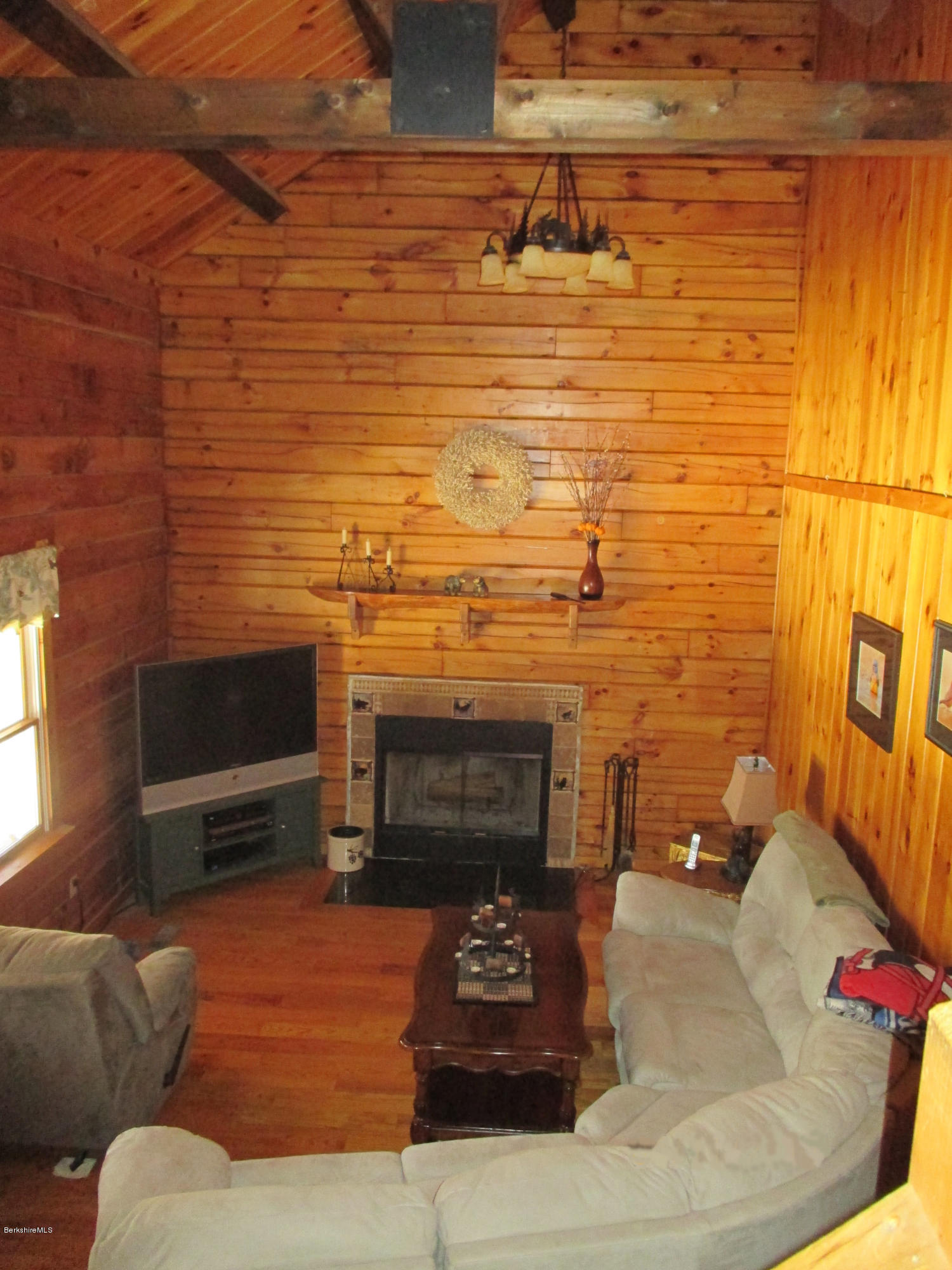 46 West Main Road Peru, MA 01235 - Photo 13 of 29 a view of a livingroom with furniture and flat screen tv