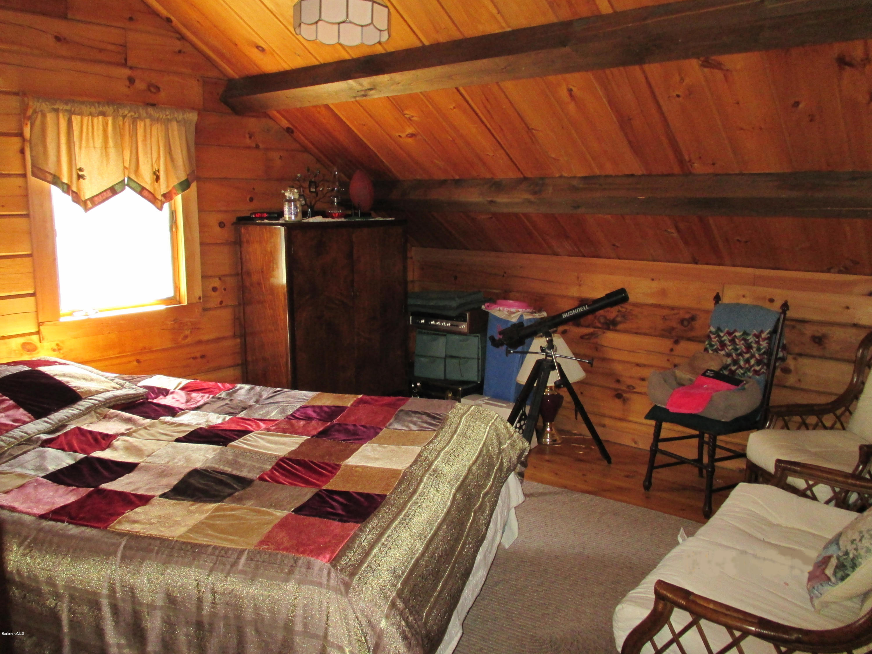 46 West Main Road Peru, MA 01235 - Photo 20 of 29 a bed sitting in a bedroom next to a window