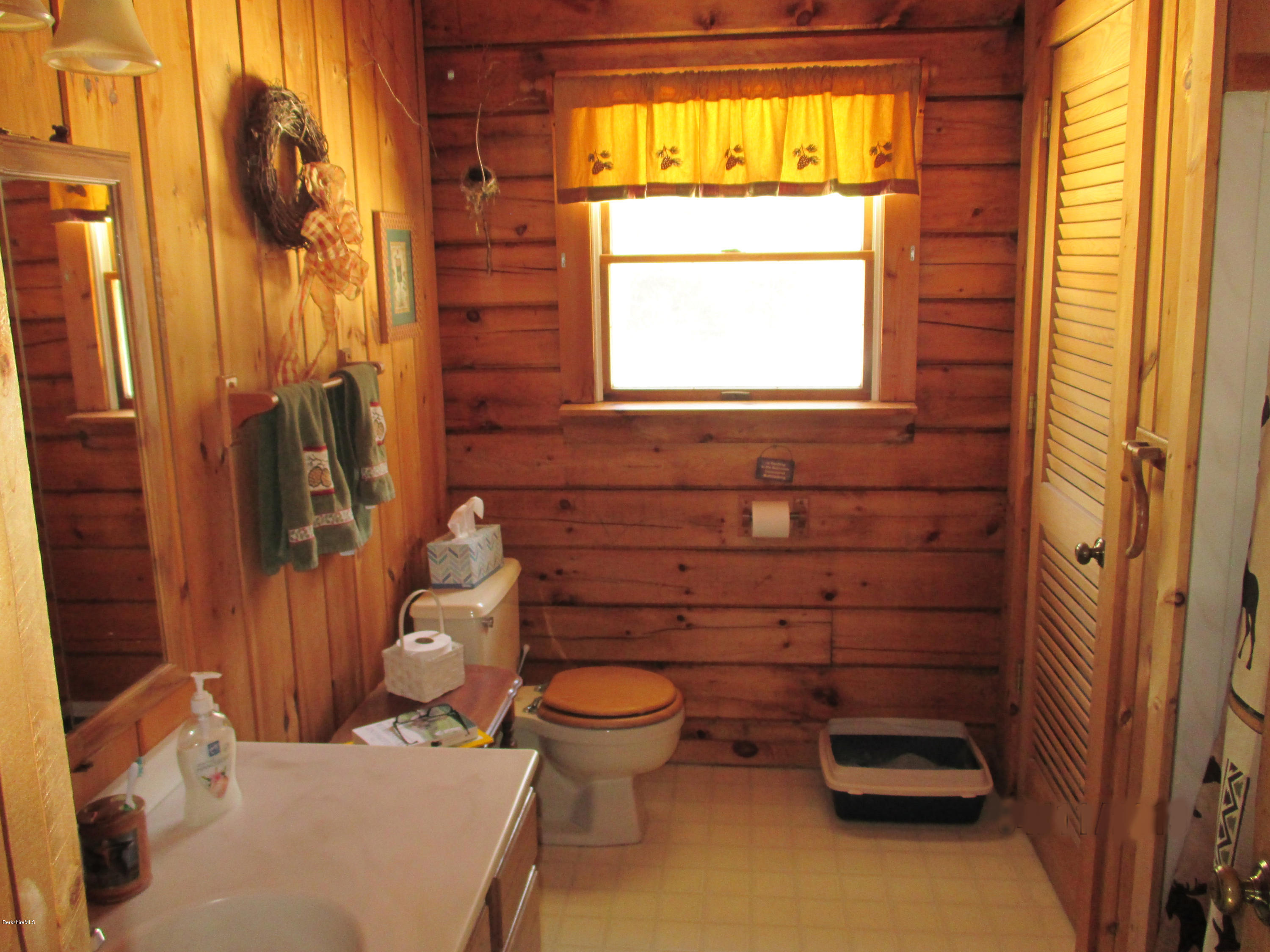 46 West Main Road Peru, MA 01235 - Photo 29 of 29 a bathroom with a toilet sink and mirror