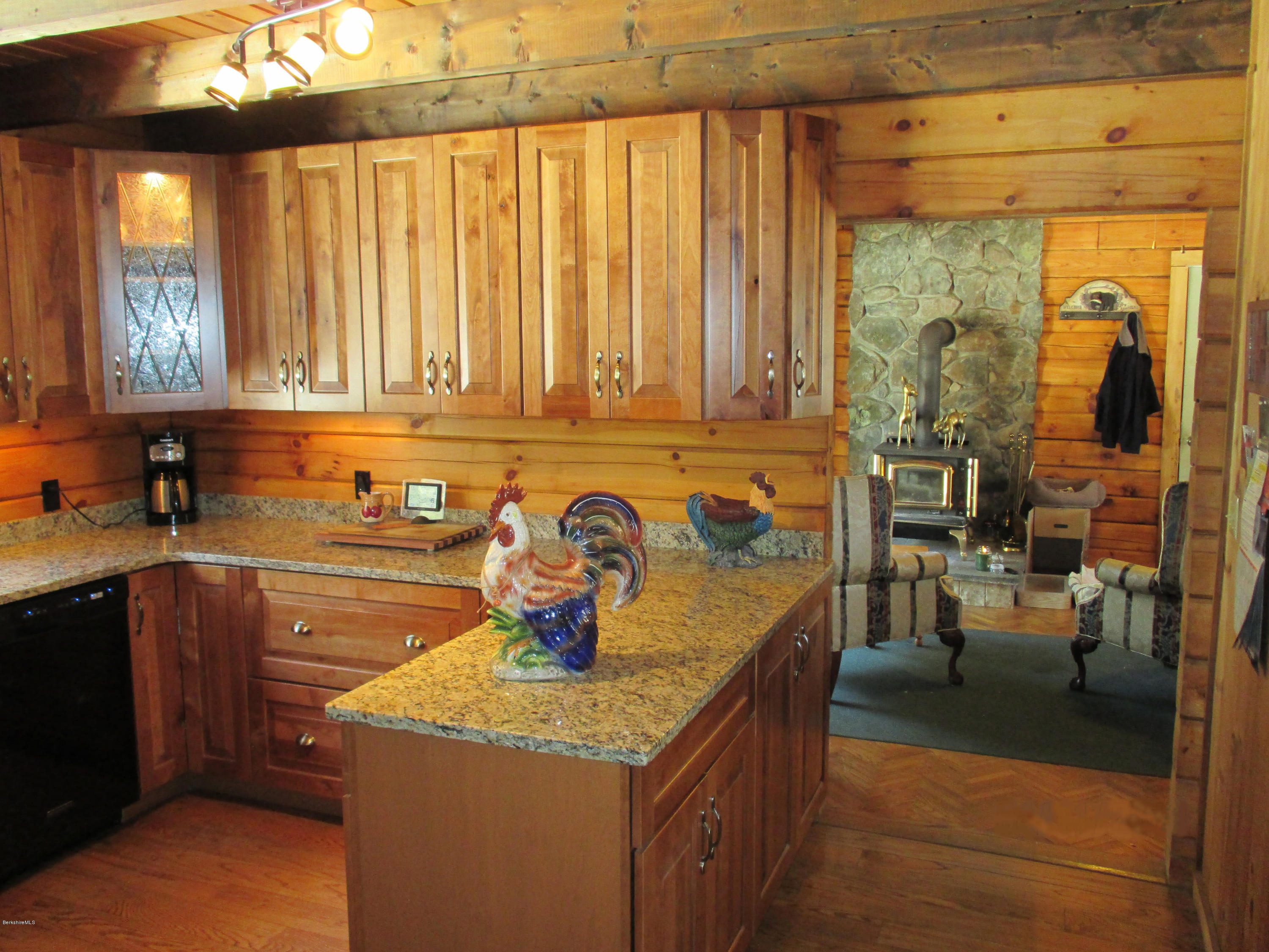 46 West Main Road Peru, MA 01235 - Photo 7 of 29 a kitchen with a stove a sink and a wooden cabinets