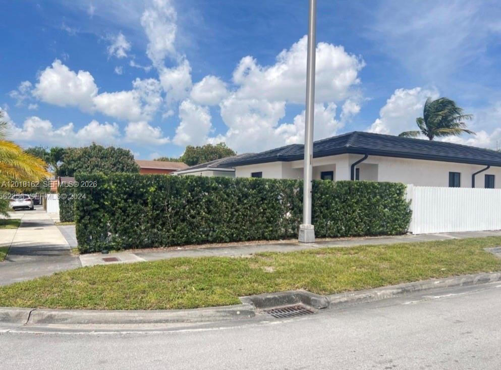 897 East 20th Street Hialeah, FL 33013 - Photo 2 of 13 a view of a house with a backyard