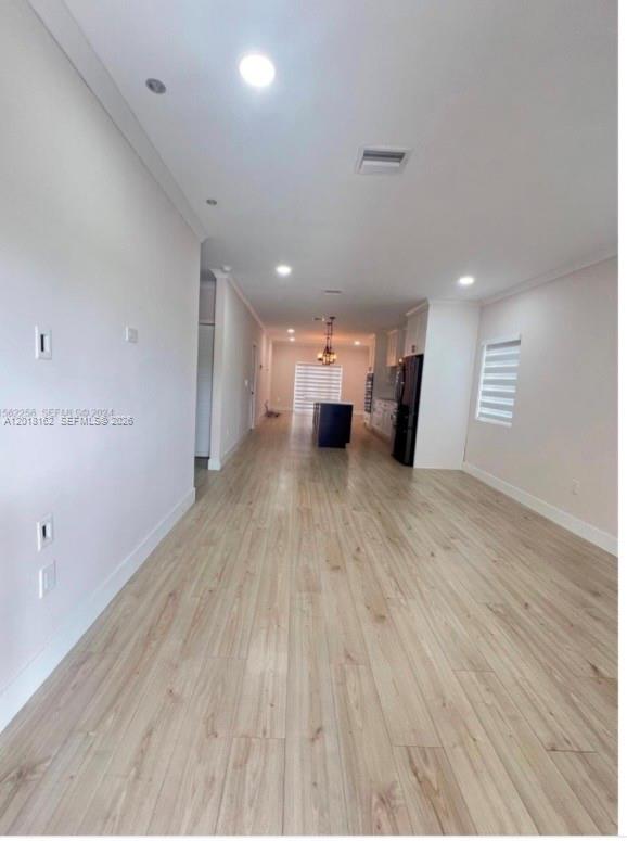 897 East 20th Street Hialeah, FL 33013 - Photo 6 of 13 a view of a room with wooden floor