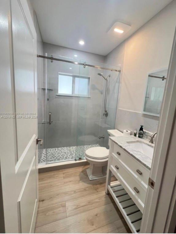 897 East 20th Street Hialeah, FL 33013 - Photo 8 of 13 a bathroom with a sink a toilet and shower