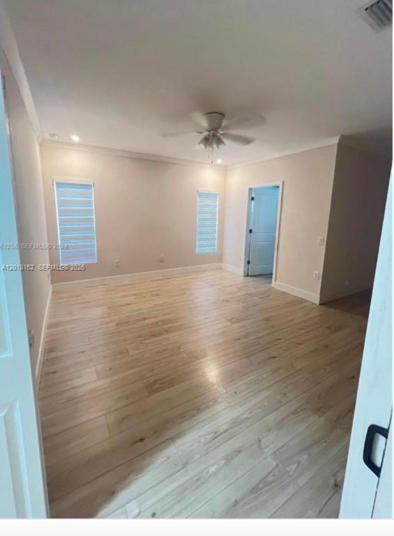 897 East 20th Street Hialeah, FL 33013 - Photo 9 of 13 a view of an empty room with wooden floor