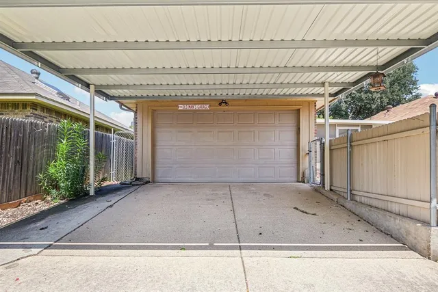 a view of a patio with table and chairs