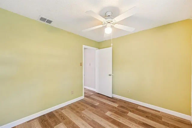 a view of a big room with wooden floor