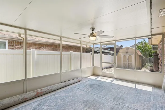 a view of a livingroom with a ceiling fan