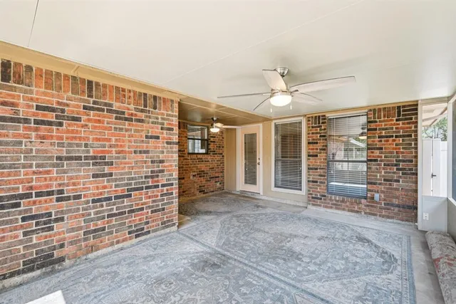 a view of an empty room with a fireplace