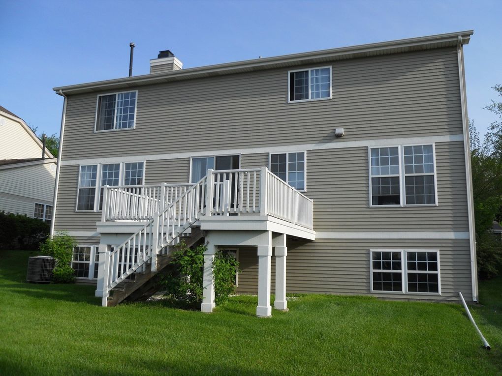 524 East Knox Street Palatine, IL 60074 - Photo 12 of 13 a view of a house with a yard and a deck