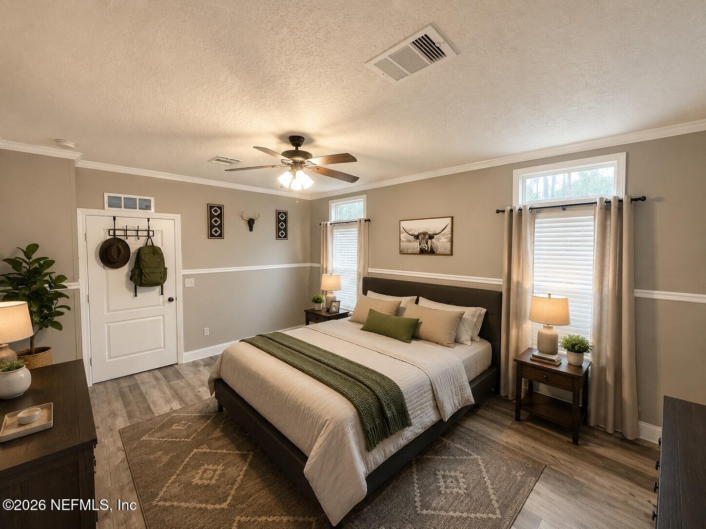 124 Jack Road Palatka, FL 32177 - Photo 8 of 18 a spacious bedroom with a bed and a chandelier
