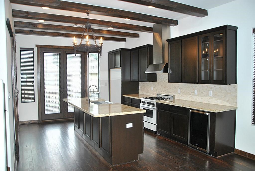 5312 Inker Street, Unit A Houston, TX 77007 - Photo 4 of 10 a kitchen with stainless steel appliances granite countertop a sink stove and refrigerator
