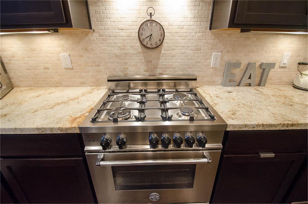 5312 Inker Street, Unit A Houston, TX 77007 - Photo 5 of 10 a stove top oven sitting inside of a kitchen