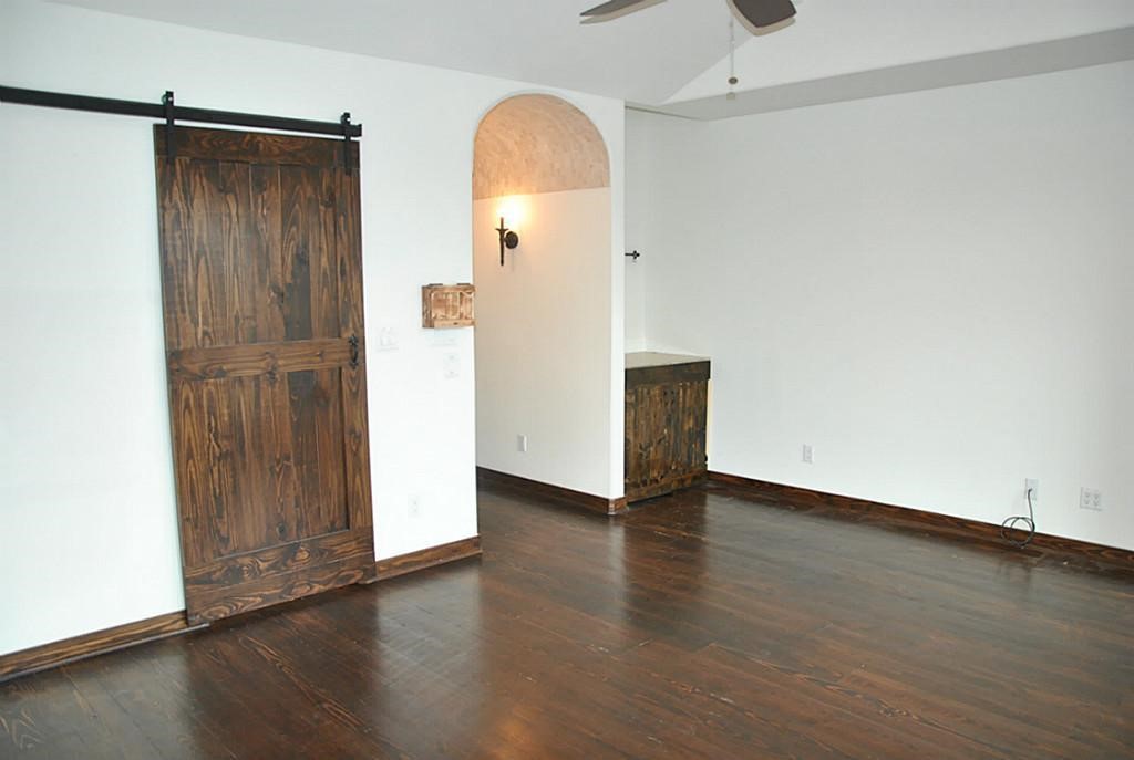 5312 Inker Street, Unit A Houston, TX 77007 - Photo 8 of 10 a view of an empty room with wooden floor and a window