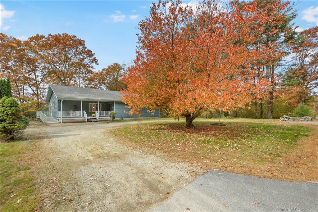 380 East Putnam Road Putnam, CT 06260 - Photo 1 of 1 a front view of a house with a yard
