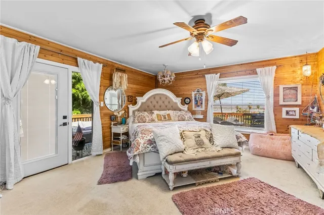 a view of a dining room with furniture wooden floor and a chandelier
