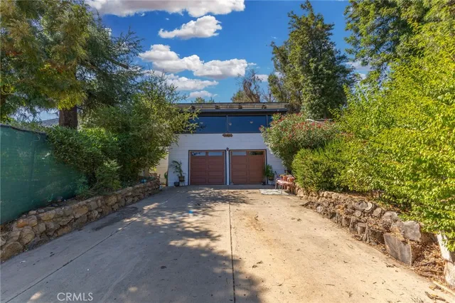 a living room with lots of furniture and wooden floor