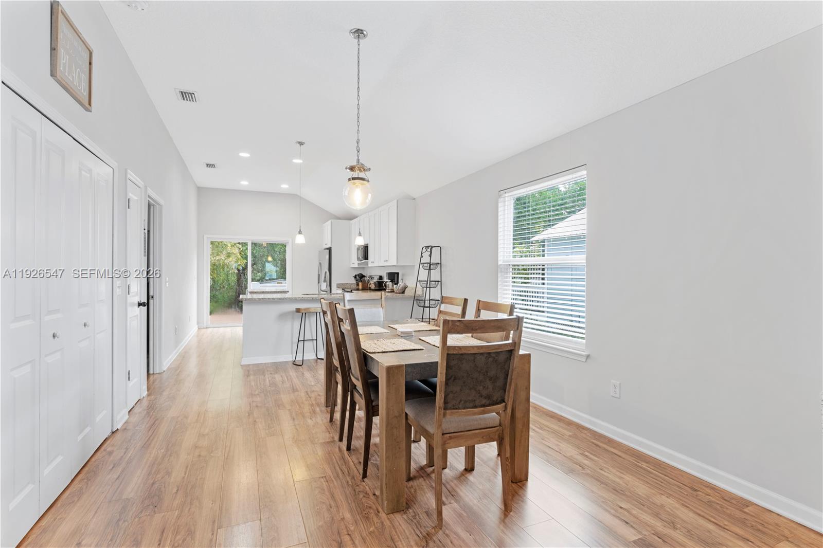 2 Poinciana Cove Road St. Augustine, FL 32084 - Photo 14 of 43 a view of a dining room with furniture window and wooden floor