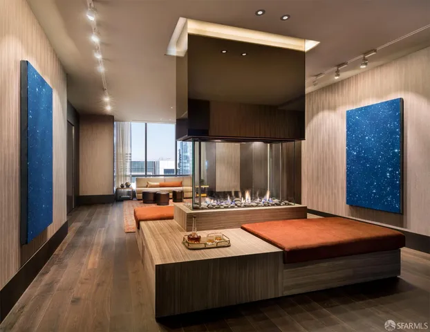 a living room with furniture pool and a large window