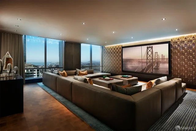 a living room with furniture and a floor to ceiling window