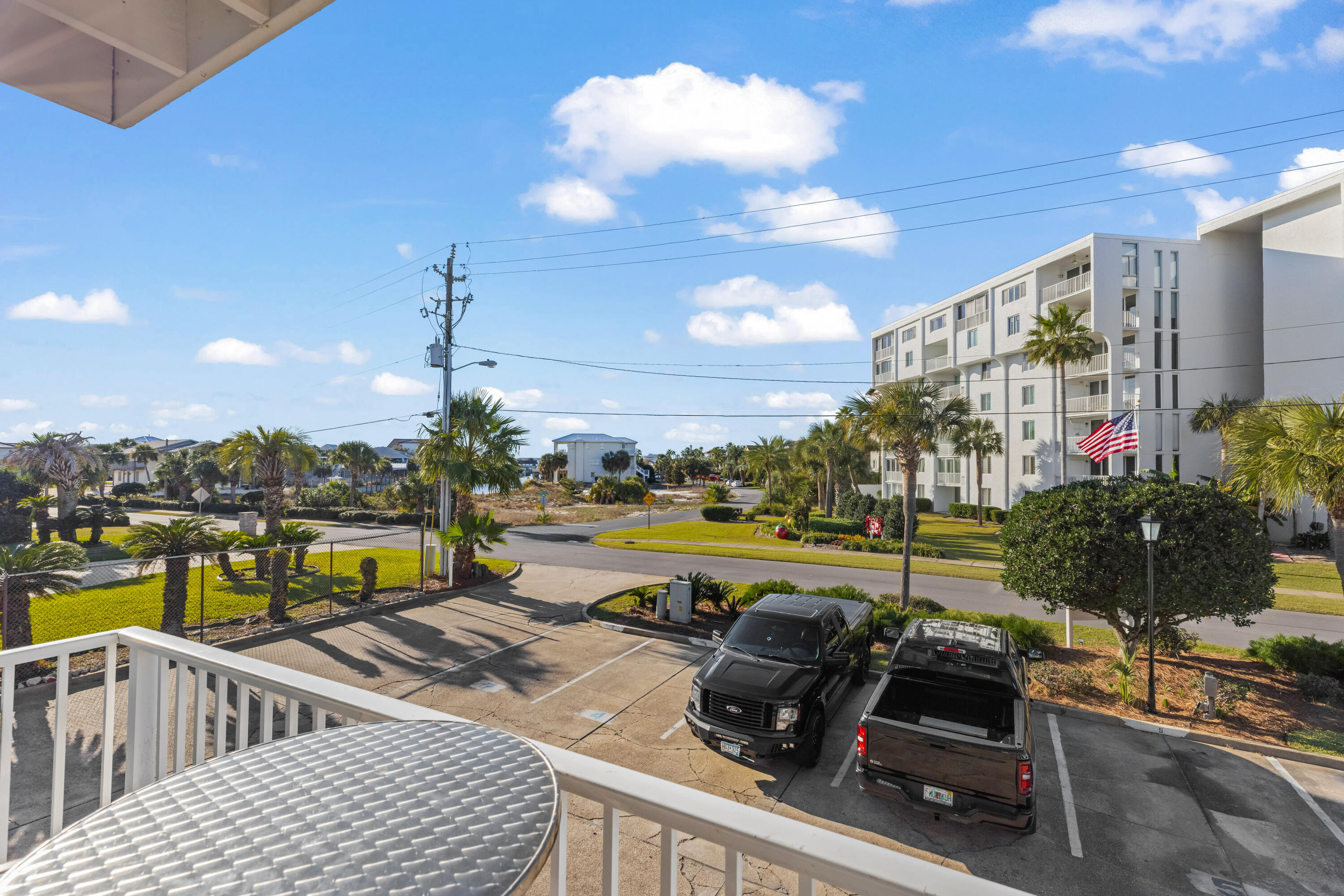 22 Moreno Point Road, Unit 3 Destin, FL 32541 - Photo 15 of 45 a view of a balcony with lake view and a floor to ceiling window