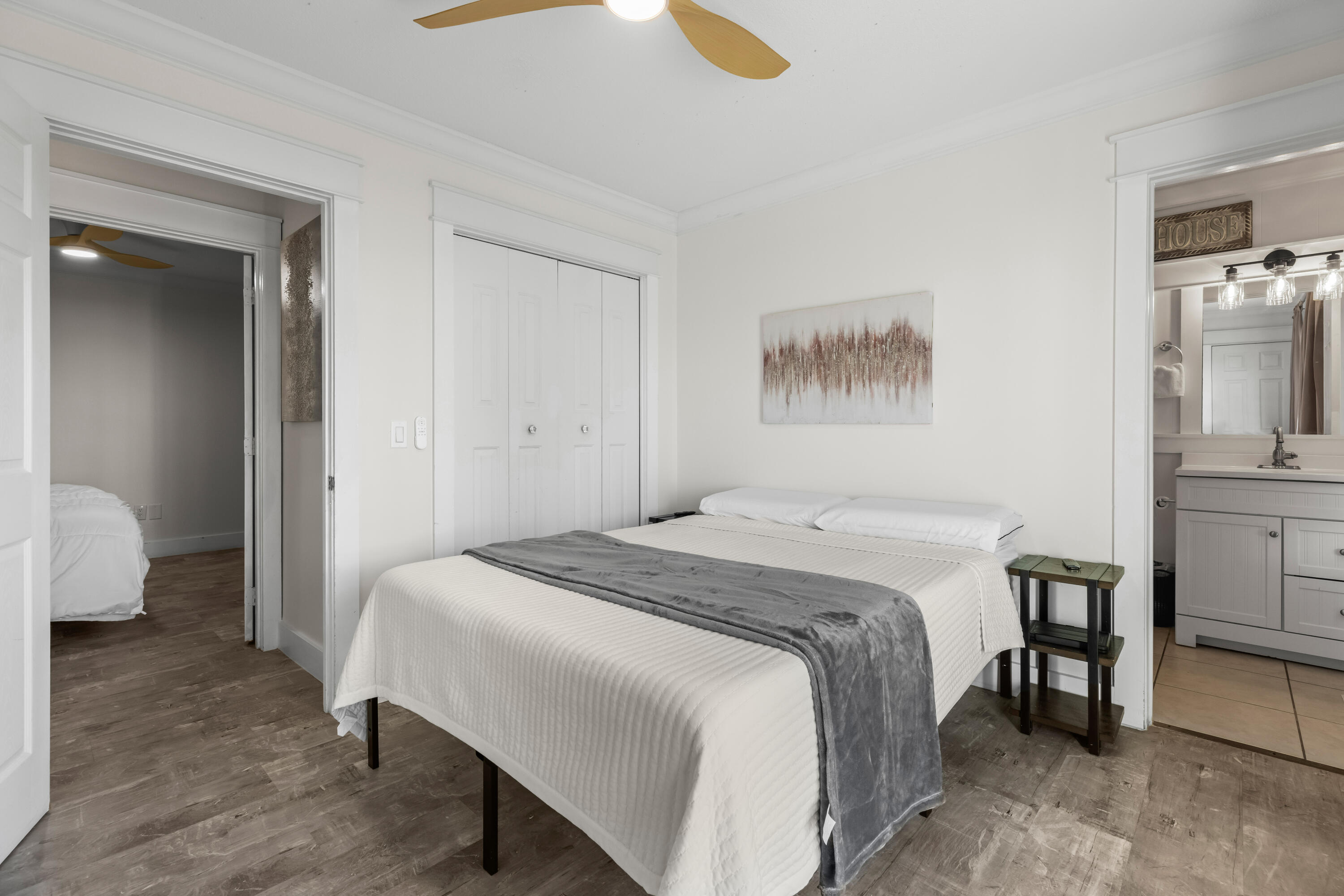 22 Moreno Point Road, Unit 3 Destin, FL 32541 - Photo 28 of 45 a bedroom with a bed and a view of bathroom