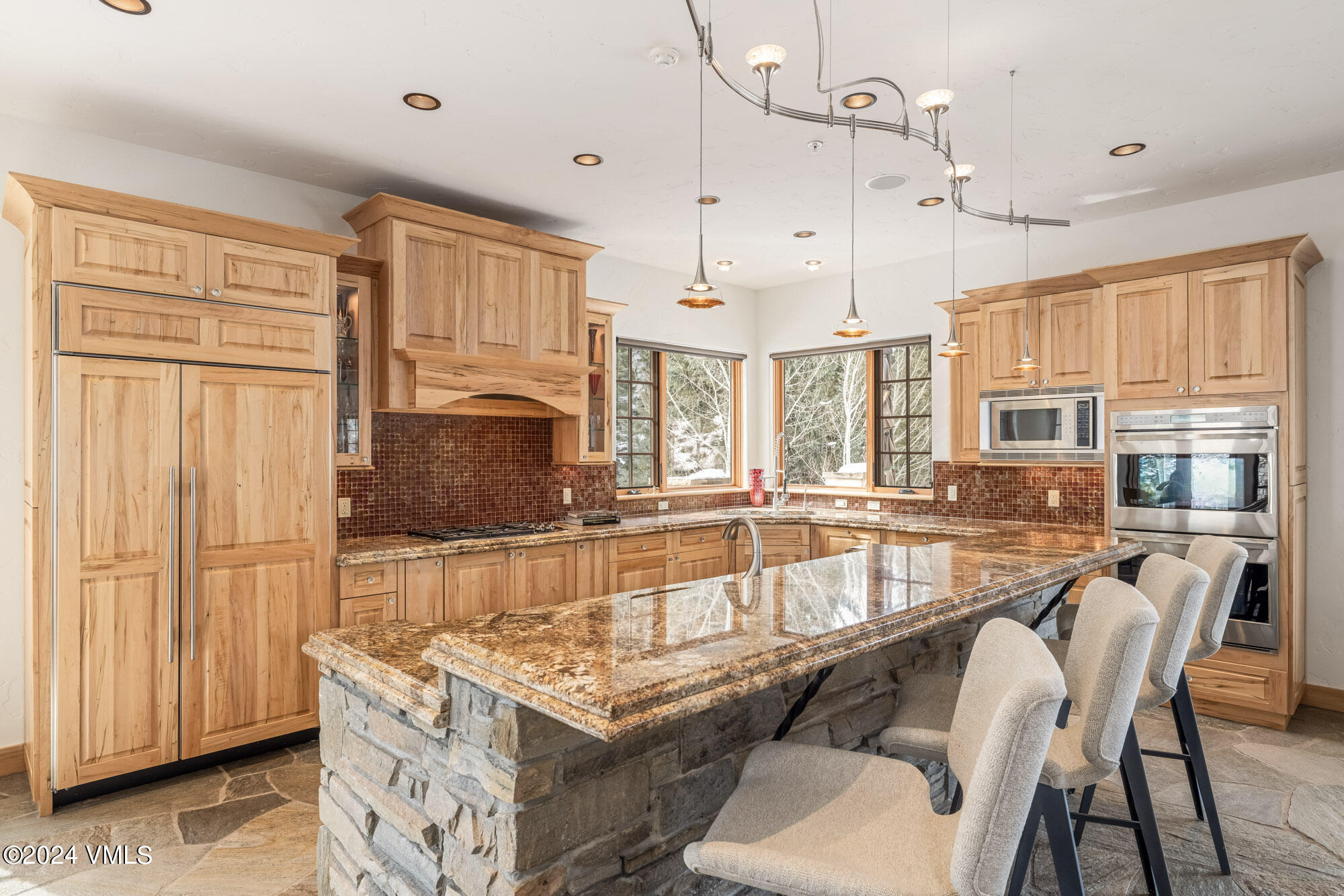 319 Granada Glen Road Edwards, CO 81632 - Photo 12 of 43 a living room with stainless steel appliances granite countertop furniture and a chandelier