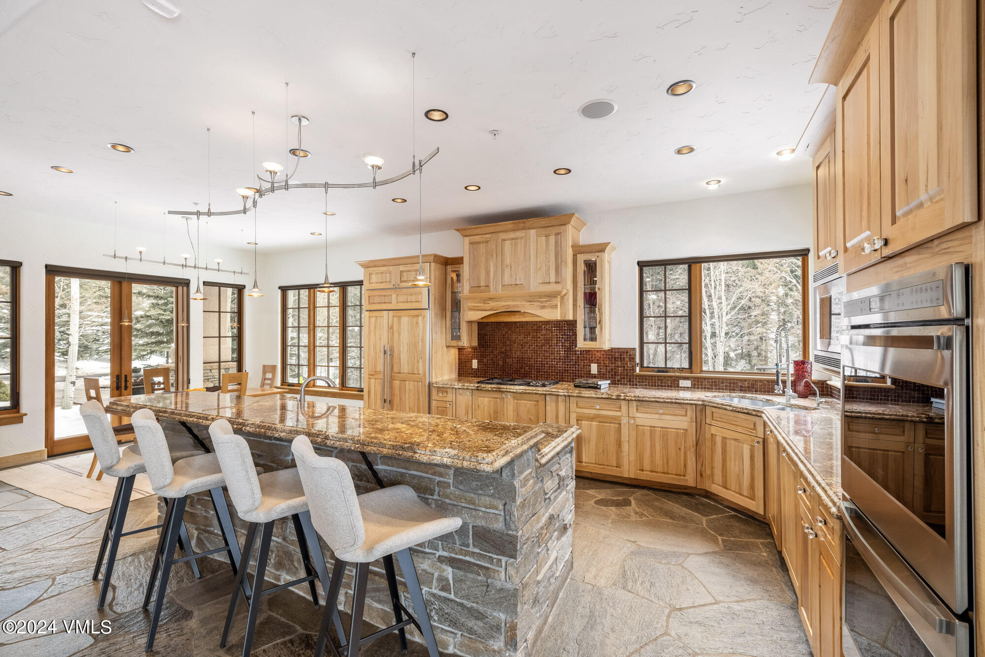 319 Granada Glen Road Edwards, CO 81632 - Photo 14 of 43 a large kitchen with a table and chairs