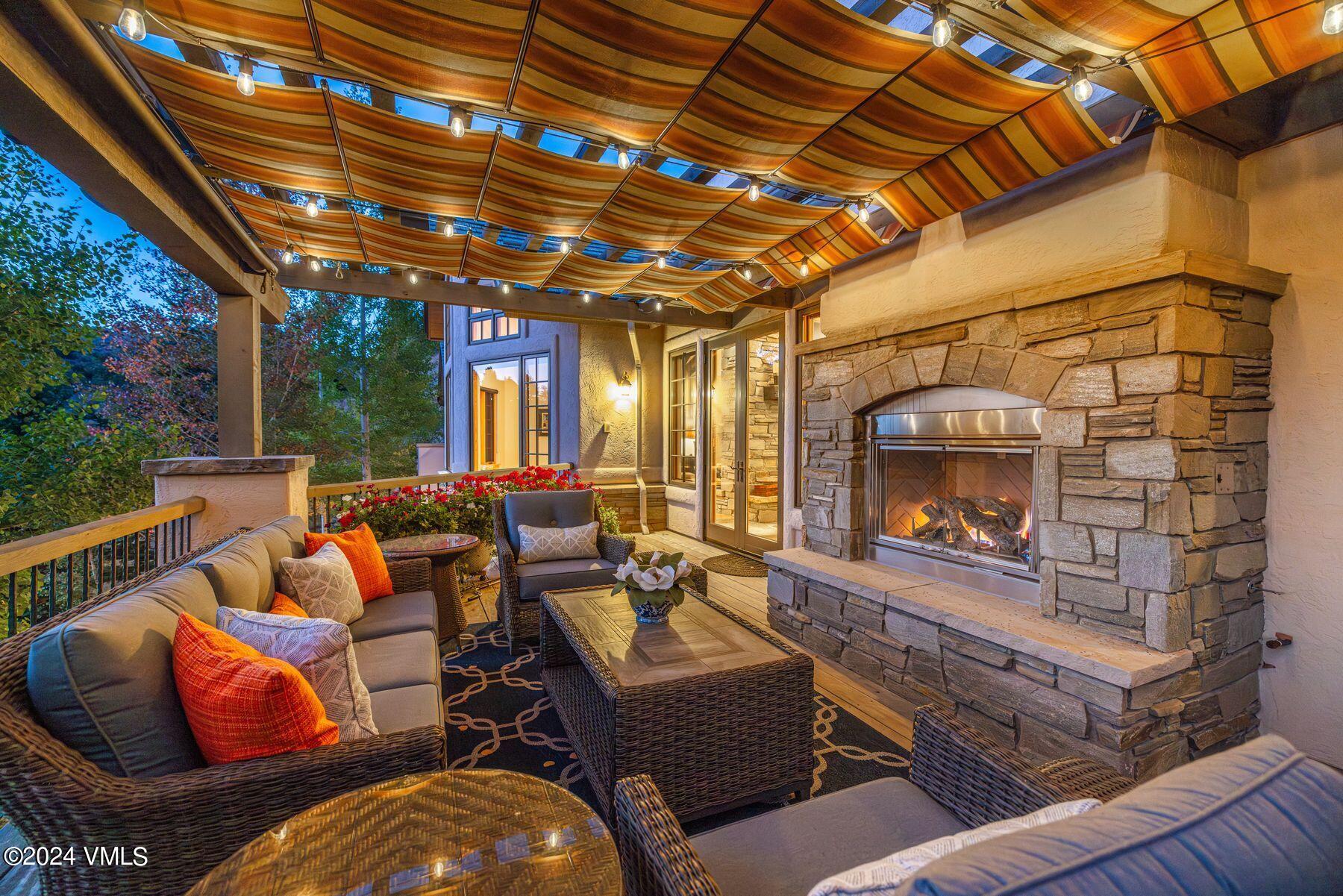 319 Granada Glen Road Edwards, CO 81632 - Photo 16 of 43 a outdoor living space with furniture and a fireplace