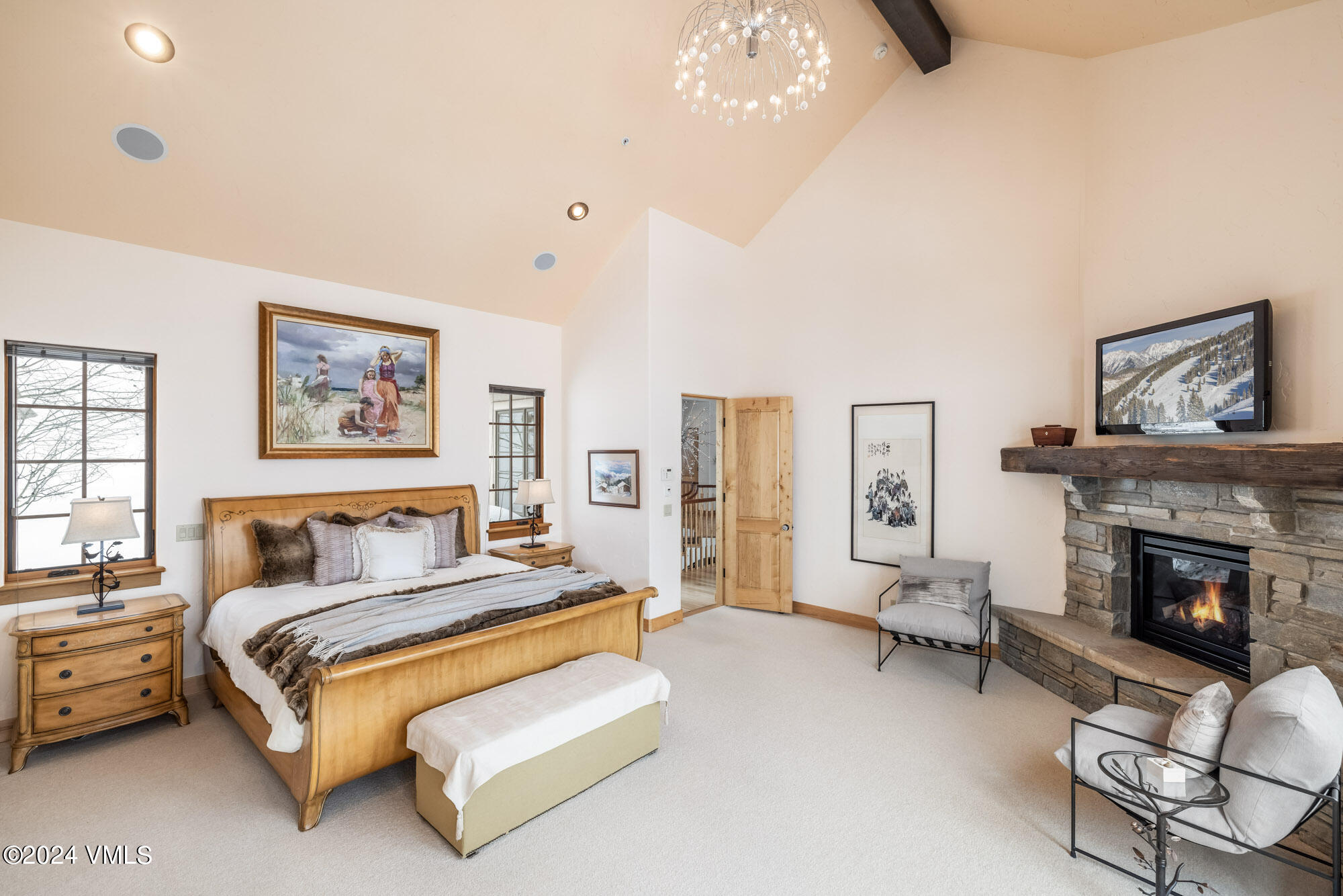 319 Granada Glen Road Edwards, CO 81632 - Photo 20 of 43 a spacious bedroom with a bed and a fireplace